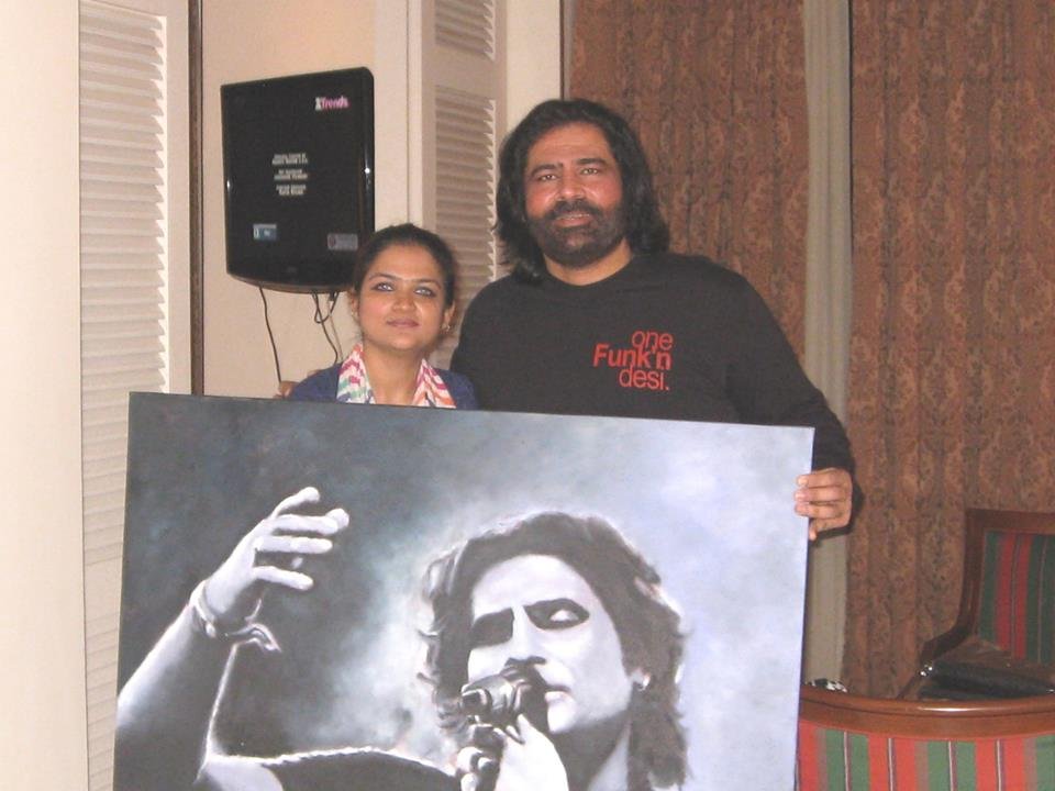 Presenting a portrait to Shafqat Amanat Ali Khansaheb
